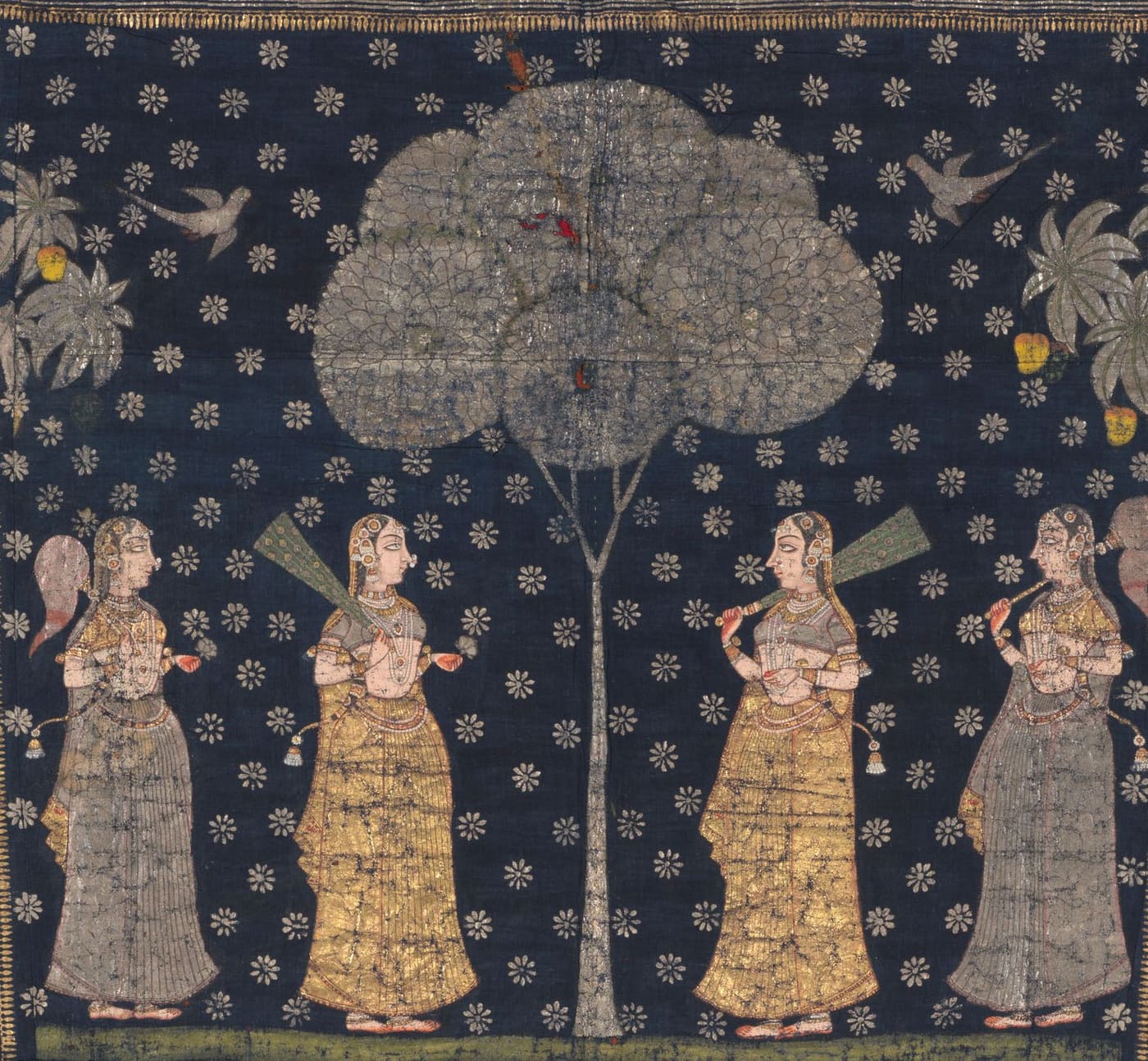 Four gopis with fans and lamps stand beneath a silver kadamba tree on a starry indigo ground